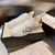 Gucci Ace Orgasmique White Sneakers: A pair of white sneakers with vibrant details, showcasing Gucci's signature "Orgasmique" pattern, adding a touch of style and elegance.