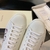 Gucci Ace Orgasmique White Sneakers: A pair of white sneakers with vibrant details, showcasing Gucci's signature "Orgasmique" pattern, adding a touch of style and elegance.