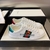 Gucci Band Ace White Sneakers: A pair of white sneakers with details of Gucci's iconic green and red stripe, showcasing sophistication and timeless style.