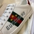 Gucci Band Ace White Sneakers: A pair of white sneakers with details of Gucci's iconic green and red stripe, showcasing sophistication and timeless style.