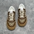 Gucci Chunky GG Monogram Brown/Beige Sneakers: A pair of Gucci Chunky sneakers with GG monogram pattern in brown and beige, reflecting an elegant and modern style.