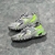 Louis Vuitton Runner Tatic Gray/Green Sneakers: A sports shoe that combines neutral tones with green details, perfect for a modern and athletic look.