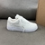 Louis Vuitton x Nike Air Force 1 Low By Virgil Abloh All White Sneakers: An exclusive white model, part of the collaboration between Louis Vuitton and Nike, designed by Virgil Abloh.