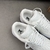 Louis Vuitton x Nike Air Force 1 Low By Virgil Abloh All White Sneakers: An exclusive white model, part of the collaboration between Louis Vuitton and Nike, designed by Virgil Abloh.