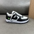 Louis Vuitton x Nike Air Force 1 Low By Virgil Abloh Black/White Sneakers: A pair of black and white sneakers, part of the collaboration between Louis Vuitton and Nike, created by Virgil Abloh.