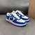 Louis Vuitton x Nike Air Force 1 Low By Virgil Abloh Blue/White Sneakers: A pair of sneakers with a blue and white design, the result of a collaboration between Louis Vuitton and Nike, created by Virgil Abloh.