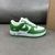 Louis Vuitton x Nike Air Force 1 Low By Virgil Abloh Green/White Sneakers: A pair of green and white sneakers, part of the collaboration between Louis Vuitton and Nike, created by Virgil Abloh.