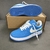 Louis Vuitton x Nike Air Force 1 Low By Virgil Abloh Light Blue Sneakers: A pair of light blue sneakers, part of the collaboration between Louis Vuitton and Nike, designed by Virgil Abloh.