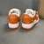 Tênis Louis Vuitton x Nike Air Force 1 Low By Virgil Abloh Orange/White: Um par de tênis em laranja e branco, resultado da colaboração entre Louis Vuitton e Nike com design exclusivo de Virgil Abloh.