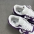 Louis Vuitton x Nike Air Force 1 Low By Virgil Abloh Purple/White Sneakers: A pair of purple and white sneakers, a collaboration between Louis Vuitton and Nike with an exclusive design by Virgil Abloh.