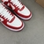 Louis Vuitton x Nike Air Force 1 Low By Virgil Abloh Red/White Sneakers: A pair of red and white sneakers, part of the collaboration between Louis Vuitton and Nike, created by Virgil Abloh.