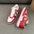 Louis Vuitton x Nike Air Force 1 Low By Virgil Abloh Red/White Sneakers: A pair of red and white sneakers, part of the collaboration between Louis Vuitton and Nike, created by Virgil Abloh.