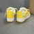 Louis Vuitton x Nike Air Force 1 Low By Virgil Abloh Yellow Sneakers: A pair of yellow sneakers from the collaboration between Louis Vuitton and Nike, designed by Virgil Abloh.