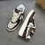 Zapatillas Louis Vuitton x Nike Air Force 1 Low By Virgil Abloh Damier Canvas Brown/White: Una zapatilla de perfil bajo con un patrón de lona a cuadros, con detalles en marrón y blanco, parte de la colección colaborativa entre Louis Vuitton y Nike, creada