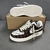 Zapatillas Louis Vuitton x Nike Air Force 1 Low By Virgil Abloh Damier Canvas Brown/White: Una zapatilla de perfil bajo con un patrón de lona a cuadros, con detalles en marrón y blanco, parte de la colección colaborativa entre Louis Vuitton y Nike, creada