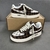 Tênis Louis Vuitton x Nike Air Force 1 Low By Virgil Abloh Damier Canvas Brown/White: Um tênis de baixo perfil em padrão damier canvas, com detalhes em marrom e branco, parte da coleção colaborativa entre Louis Vuitton e Nike, criada por Virgil Abloh.