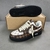 Tênis Louis Vuitton x Nike Air Force 1 Low By Virgil Abloh Damier Canvas Brown/White/Black: Um calçado em padrão damier canvas, cores marrom, branco e preto, parte da colaboração entre Louis Vuitton e Nike, desenhado por Virgil Abloh.