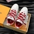 LV Skate White/Red Sneakers: An image of Louis Vuitton sneakers with an elegant design, predominantly white with red details, ideal for a sporty and modern style.