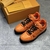 Tênis LV Trainer Laranja: Uma imagem de um par de tênis Louis Vuitton em uma vibrante tonalidade de laranja, ideal para adicionar um toque de cor aos looks casuais.