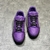 Purple LV Trainer Sneakers: An image of a pair of Louis Vuitton sneakers in a shade of purple, elegant and modern for various occasions.