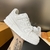 LV Trainer Calf Leather White Sneakers: A modern and elegant white leather shoe, perfect for a sophisticated and casual look at the same time.