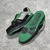 Tênis LV Trainer Crystals Black/Green: Tênis preto com detalhes em verde e cristais, ideal para quem busca estilo e sofisticação com um toque de cor e brilho.