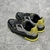 Tênis LV Trainer Crystals Black/Yellow: Tênis preto com detalhes em amarelo e cristais, elegante e moderno, perfeito para quem busca estilo e sofisticação com um toque vibrante de cor.