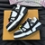 LV Trainer Maxi Black/White Sneakers: Elegant design in black and white, ideal for combining with different styles and occasions.