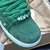 LV Trainer Maxi Green Sneakers: Footwear with a vibrant green hue, ideal for adding a touch of color to your looks. Stylish and comfortable for various occasions.