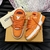 LV Trainer Maxi Orange Sneakers: Sports shoes with vibrant orange details, perfect for an urban and modern style.