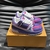 LV Trainer Maxi Purple/Pink Sneakers: Shows a pair of sneakers with a mix of purple and pink, perfect for those looking for vibrant and elegant footwear for any occasion.