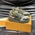 LV Trainer Maxi Damoflage Khaki Green Sneakers: Shows a pair of sneakers with a camouflage print in shades of military green, a striking and urban style for those looking for a modern and relaxed look.