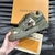 LV Trainer Maxi Damoflage Khaki Green Sneakers: Shows a pair of sneakers with a camouflage print in shades of military green, a striking and urban style for those looking for a modern and relaxed look.