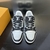 LV Trainer Monogram Denim Black/White Sneakers: These Louis Vuitton sneakers feature black and white monogram denim details for a sleek, contemporary look.