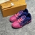 Pink/Purple LV Trainer Tie-Dye Sneakers: A cool shoe with a tie-dye pattern in shades of pink and purple, ideal for a vibrant and stylish look.