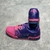 Pink/Purple LV Trainer Tie-Dye Sneakers: A cool shoe with a tie-dye pattern in shades of pink and purple, ideal for a vibrant and stylish look.