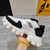 Prada Cloudbust Thunder White and Black Sneakers: Sneakers with black details, part of Prada's Cloudbust Thunder line, known for its innovative and modern design.