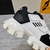 Prada Cloudbust Thunder White and Black Sneakers: Sneakers with black details, part of Prada's Cloudbust Thunder line, known for its innovative and modern design.