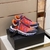 Versace Trigreca "Orange/Pink/Purple" Sneakers: Vibrant orange, pink and purple sports shoes from Versace's Trigreca line, featuring the iconic Medusa logo and high-quality details.