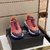 Versace Trigreca "Orange/Pink/Purple" Sneakers: Vibrant orange, pink and purple sports shoes from Versace's Trigreca line, featuring the iconic Medusa logo and high-quality details.