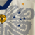 Imagem do Camisa Cruzeiro IV (Consciência Negra) 23/24 - Adidas Torcedor Masculina - Bege com detalhes em azul e amarelo