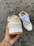 TÊNIS DUNK LOW Dourado e white na internet