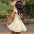 Imagem do "Renda Radiante: Arrase com o Mini Vestido Branco Mozision - Um Elegante e Sedutor Design Sem Mangas e Sem Costas para Realçar Sua Beleza Sob o Sol!"