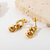 ARETES CADENA CUBANA ACERO CHAPADO ORO 14K