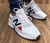 New Balance Branco c/ Azul e Vermelho