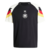 Germany Pre-Match 24/25 Jersey: Front view. Black design with white sleeves and German flag colors. Central DFB crest and Adidas logo. Black round collar, worn by players during Euro 2024