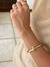 Bracelete liso T banhado em ouro 18k e ródio