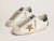 golden-goose-super-star-ltd-with-gold-star-and-black-glitter-heel