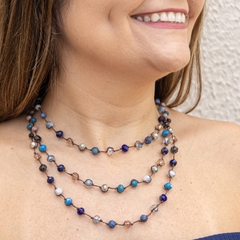 Embroidered necklace with crystals in shades of blue.