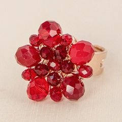 Adjustable ring, plated in 18-carat gold, embroidered with a crystal in red tones.